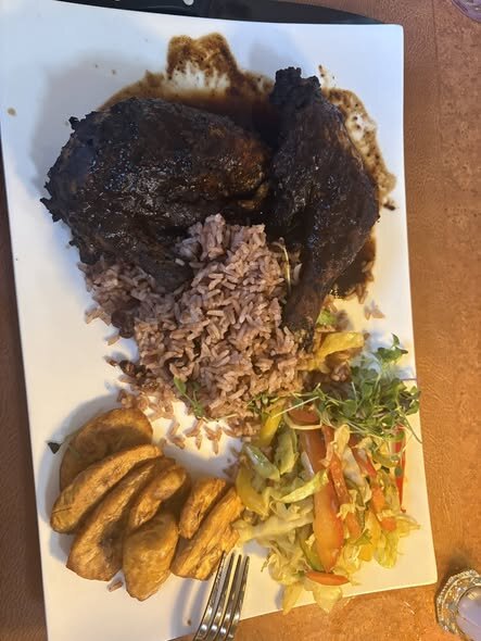 Jerk chicken plate with rice and peas at TTs Kitchen