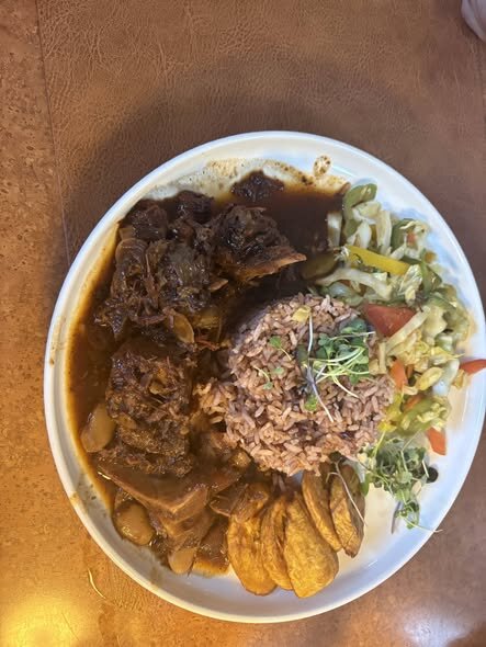 Oxtail plate with rice and peas at TTs Kitchen