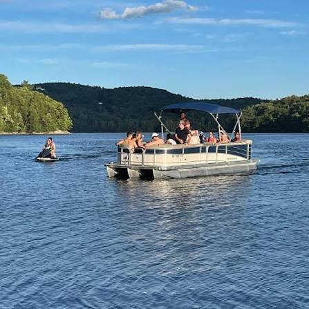 Pontoon boat and waverunner on Lake Whitingham