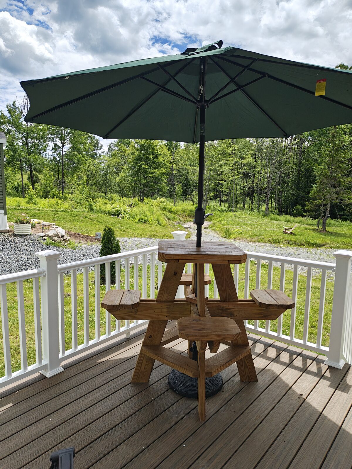 Picnic table with umbrella on the deck