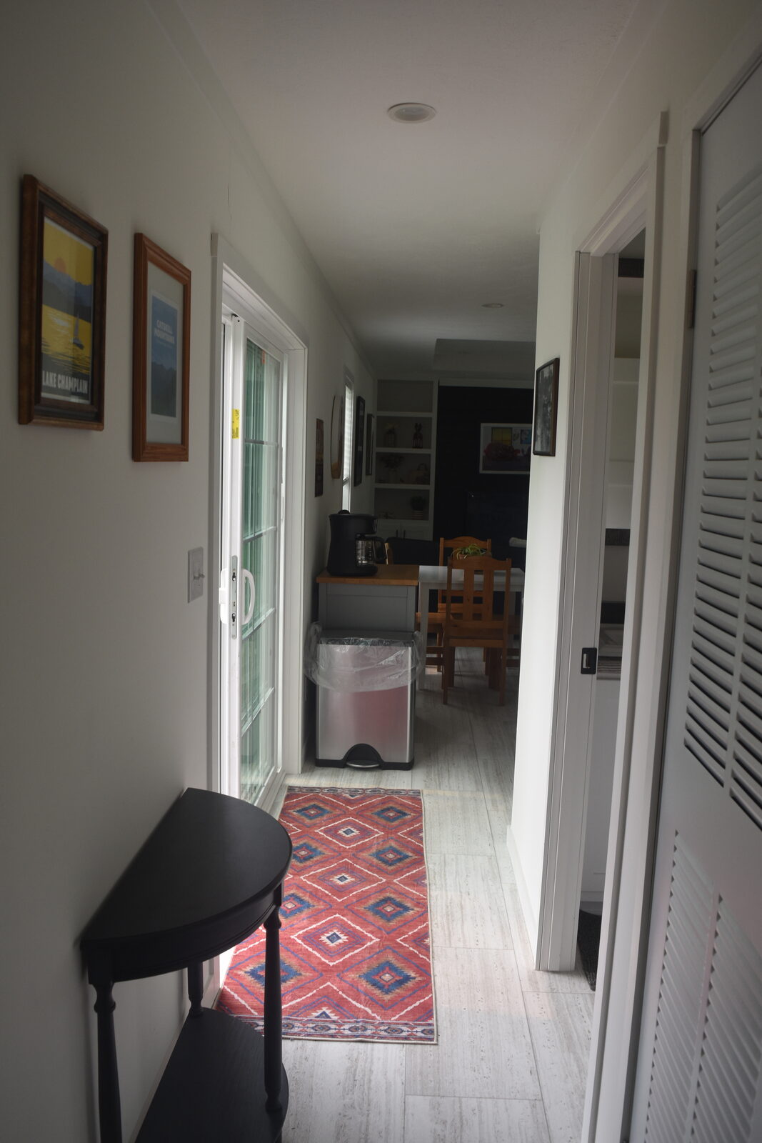 Unit B hallway with framed travel posters